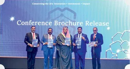 Conference brochure release on stage at the Kuwait curtain raiser